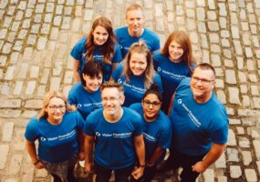 group picture of Vision Foundation staff in matching blue t-shirts