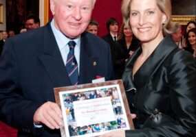 The Countess of Wessex presents a certificate of appreciation to Sir Donald Gosling