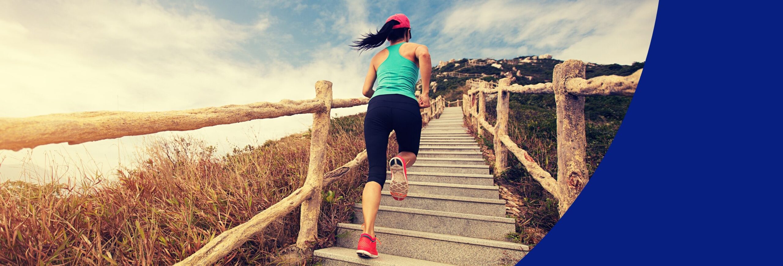 Image shows a woman climbing outdoor stairs in fitness clothes.